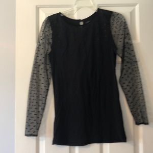 Black top with polka dot see through sleeves